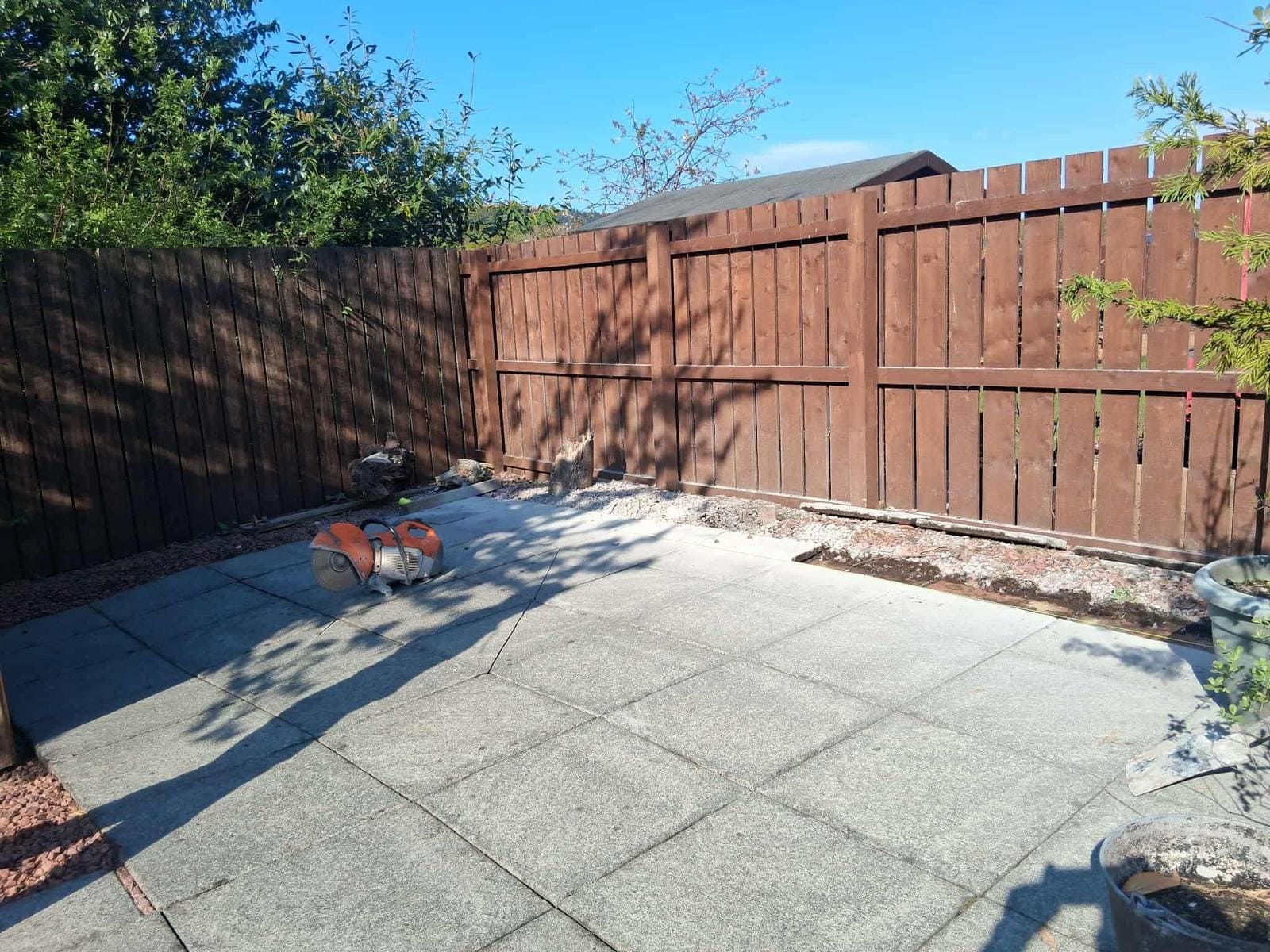 Close-board timber fence with patio area in Glasgow garden