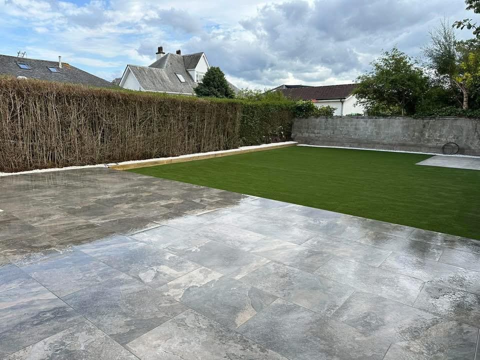 Fresh turf alongside new patio area