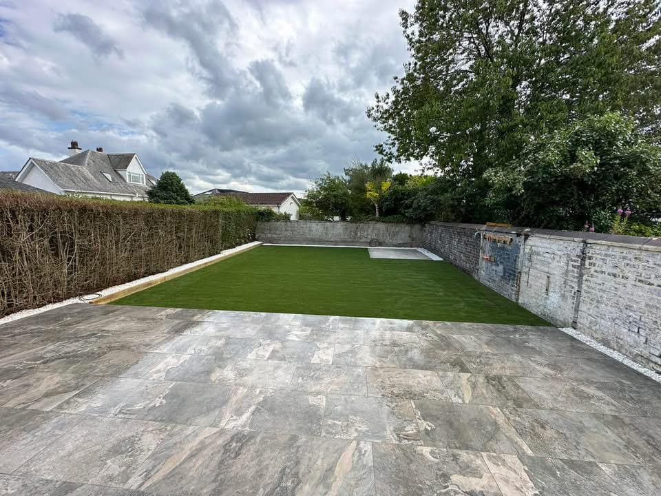 Completed garden with porcelain patio and fresh turf